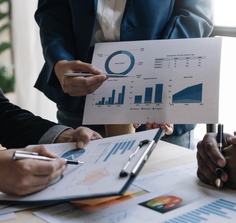 Market based valuation analysis showing data trends, graphs, and insights during a business meeting in an office setting Market based valuation