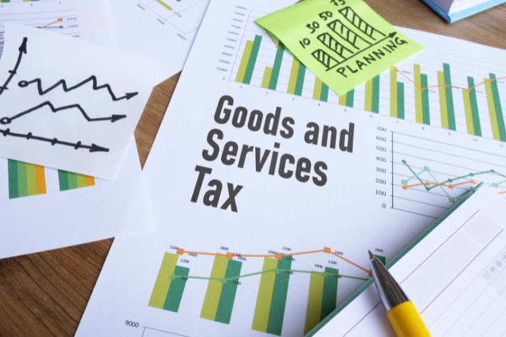Business valuation services with tax analysis and planning documentation on a desk Tax analysis and planning documentation
